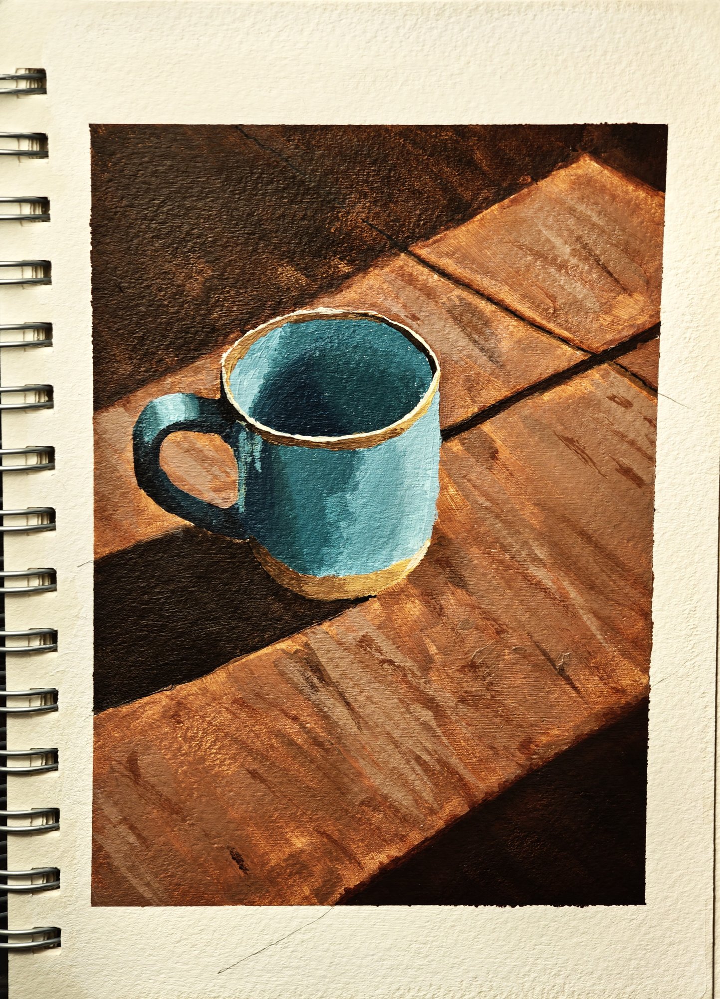 Acrylic study of a teal enamel mug on a wooden table in strong light