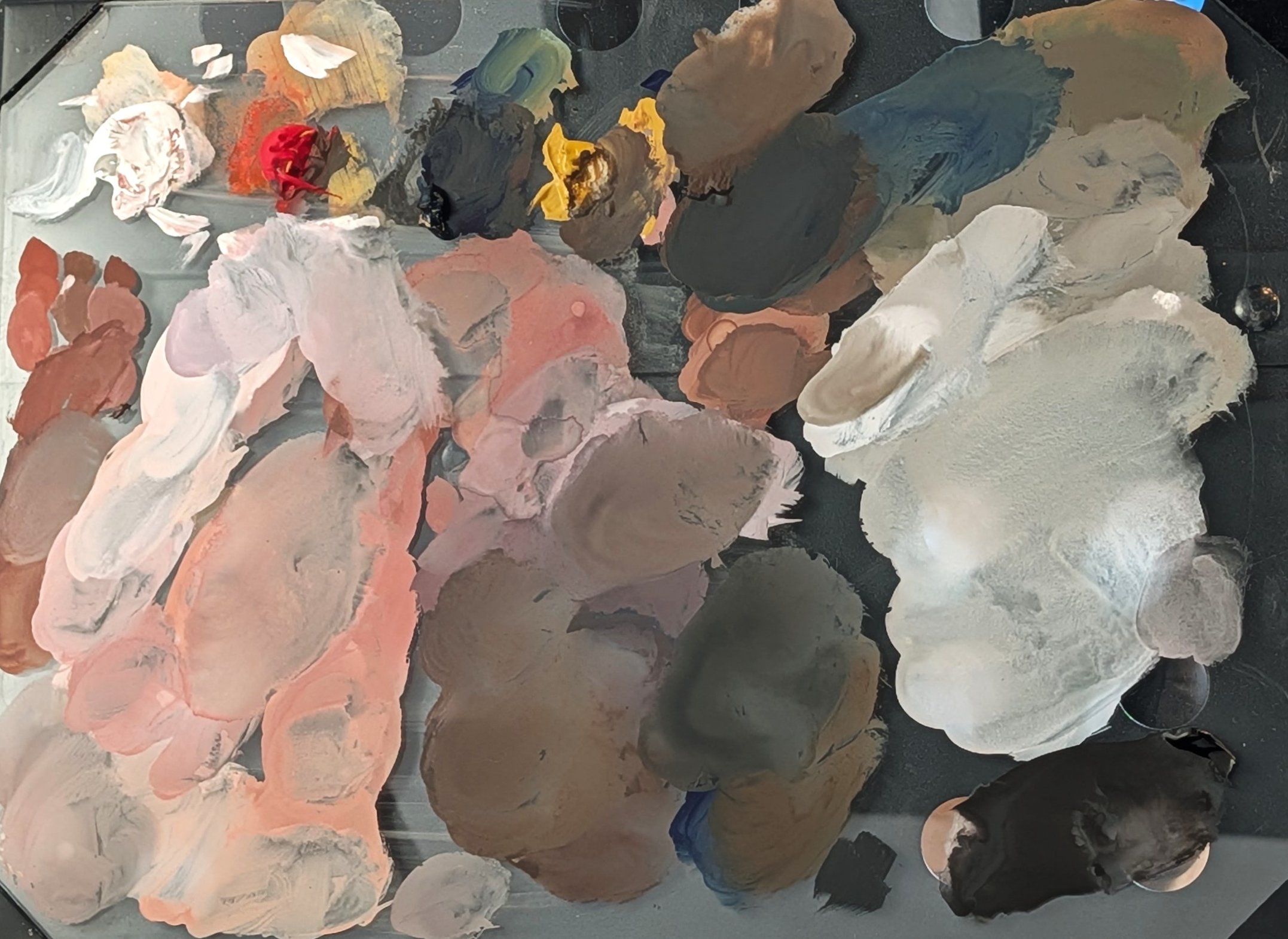 The gouache palette after the study, mixes spread everywhere